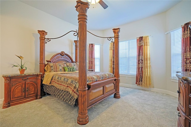 bedroom featuring ceiling fan and light carpet