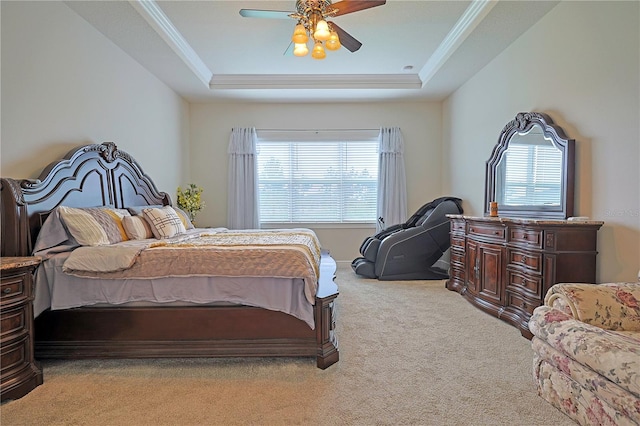 bedroom featuring ceiling fan, a raised ceiling, light carpet, and multiple windows