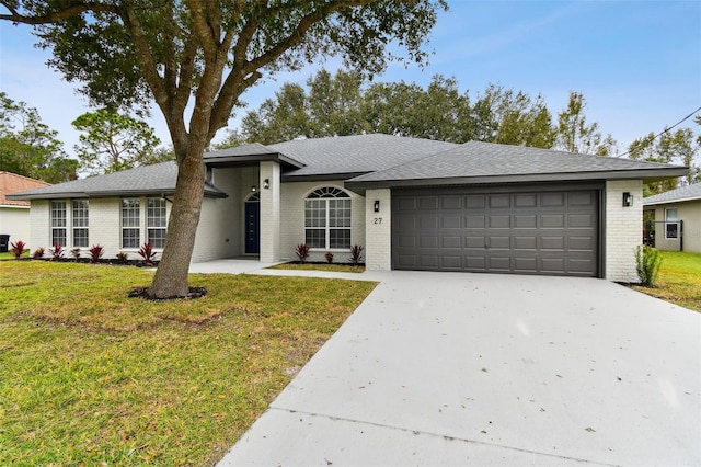 ranch-style house with a front yard and a garage