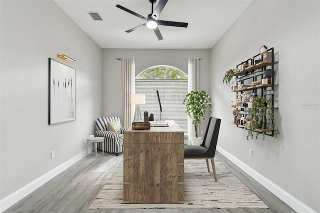 interior space featuring light hardwood / wood-style floors and ceiling fan