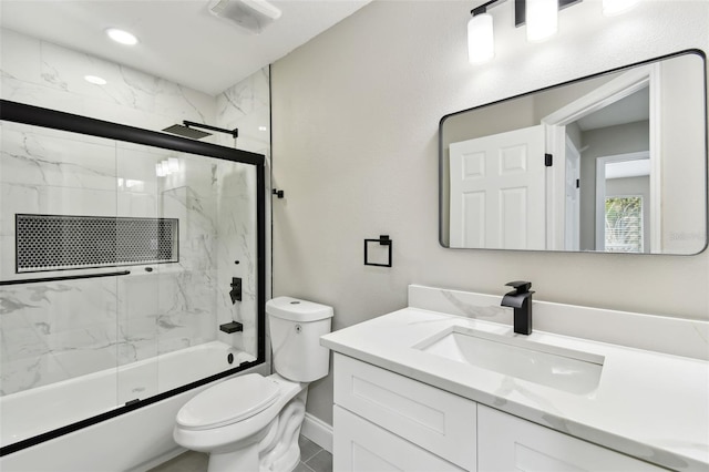 full bathroom with vanity, toilet, and bath / shower combo with glass door