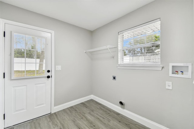 laundry area with hardwood / wood-style floors, electric dryer hookup, and washer hookup