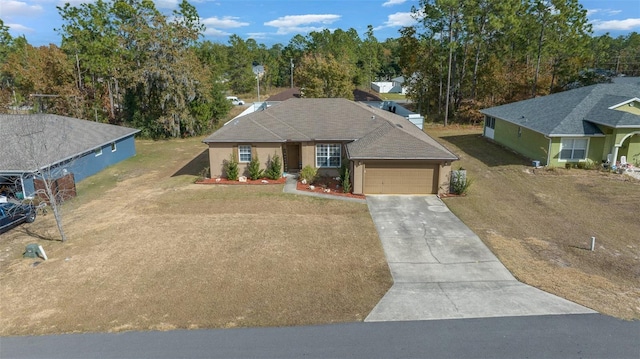 view of front of property with a garage and a front lawn