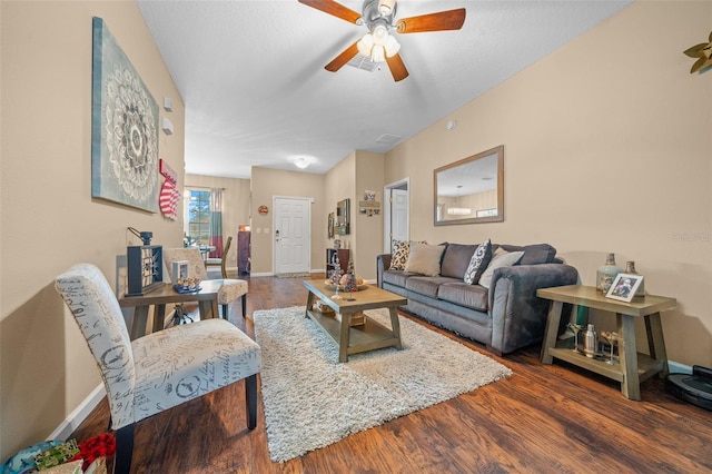 living room featuring dark hardwood / wood-style floors and ceiling fan