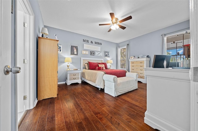 bedroom featuring ceiling fan and dark wood-type flooring