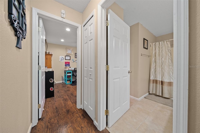 hallway featuring hardwood / wood-style flooring