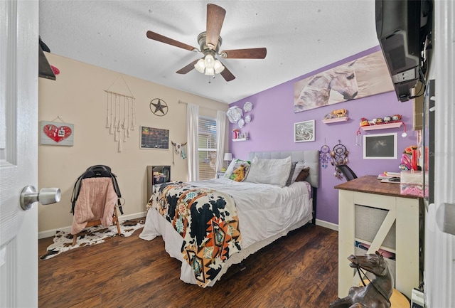 bedroom featuring a textured ceiling, ceiling fan, and dark wood-type flooring