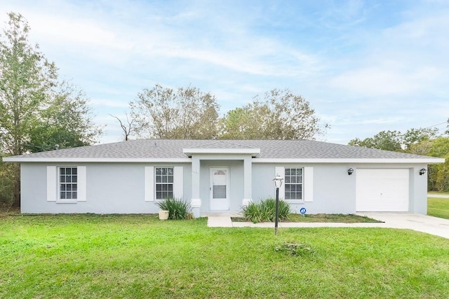 single story home with a garage and a front lawn