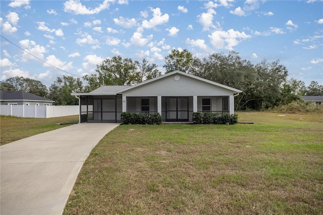 single story home with a front yard and a sunroom