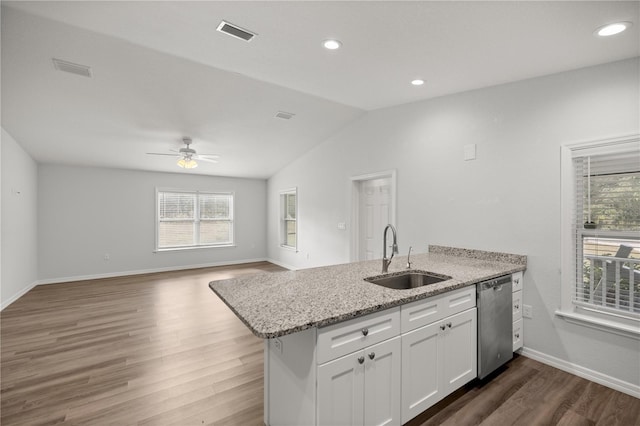 30 Maple Crse, Ocklawaha, FL 32179 - kitchen with dishwasher, a sink, a peninsula, white cabinets, and wood finished floors