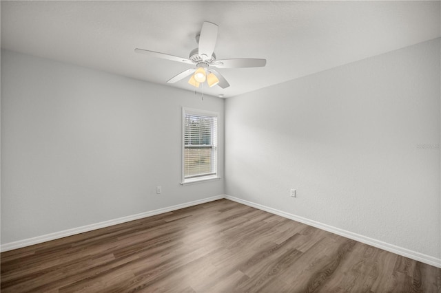 30 Maple Crse, Ocklawaha, FL 32179 - unfurnished room with dark wood-style floors, baseboards, and ceiling fan