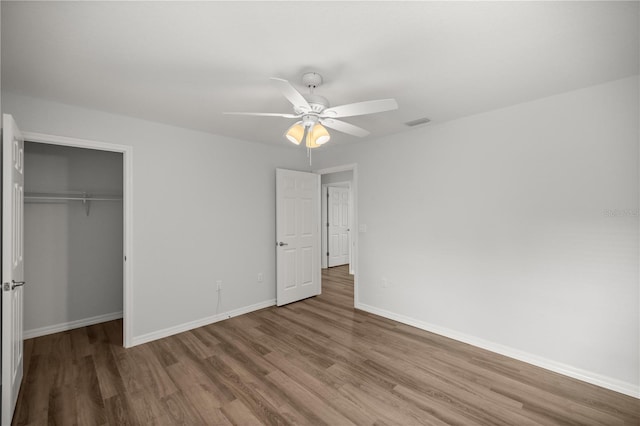 30 Maple Crse, Ocklawaha, FL 32179 - unfurnished bedroom with wood finished floors, baseboards, a closet, and ceiling fan