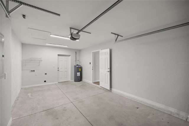 garage with electric water heater and a garage door opener