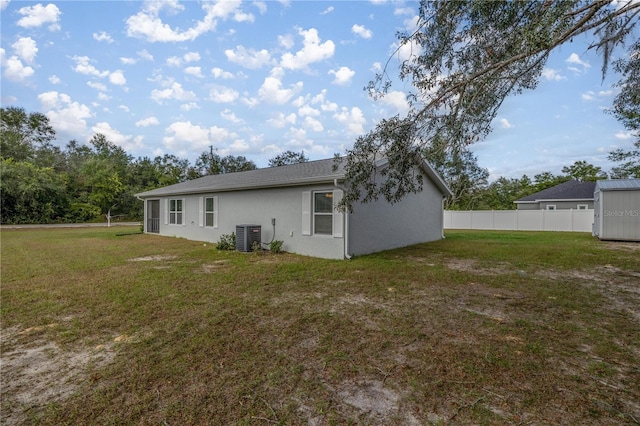 30 Maple Crse, Ocklawaha, FL 32179 - rear view of property with stucco siding and central air condition unit