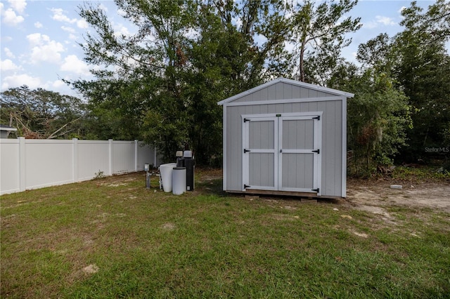 view of outbuilding featuring a yard