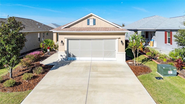 view of front facade featuring a garage and a front lawn