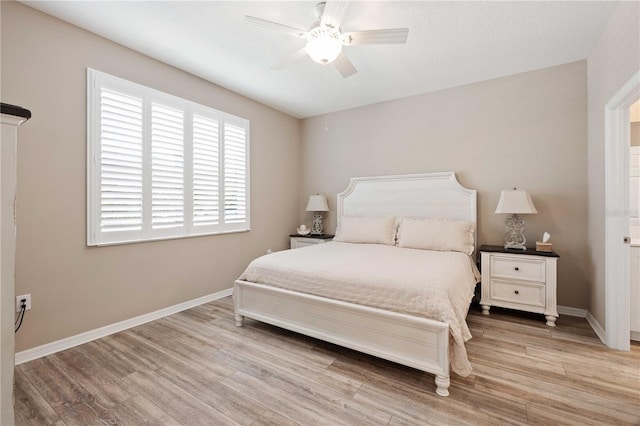 bedroom with ceiling fan and light hardwood / wood-style flooring