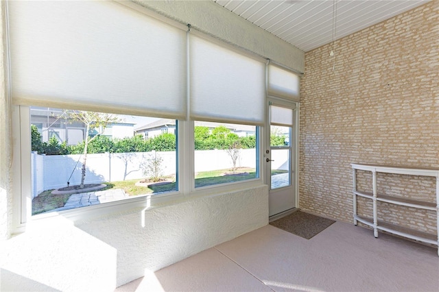 unfurnished sunroom with plenty of natural light