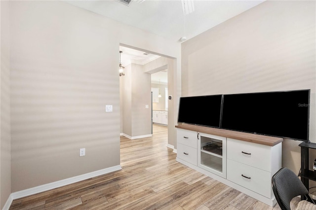 unfurnished living room featuring light hardwood / wood-style floors and ornamental molding