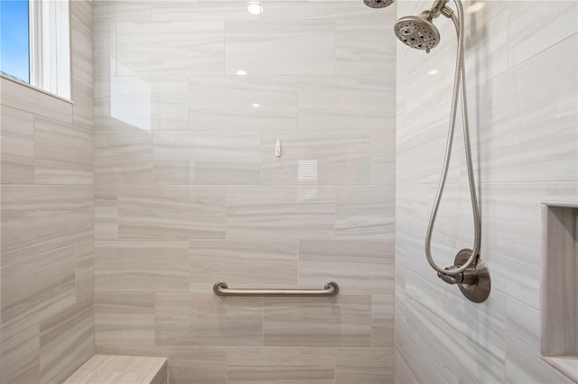 bathroom with a tile shower