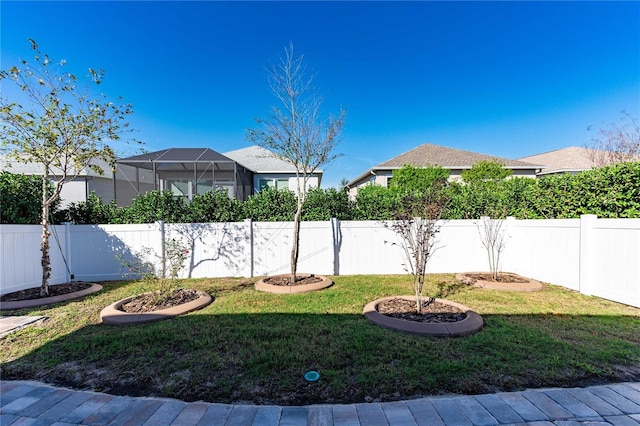 view of yard featuring a lanai