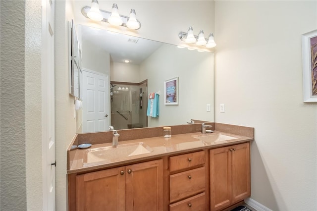 bathroom featuring vanity and an enclosed shower