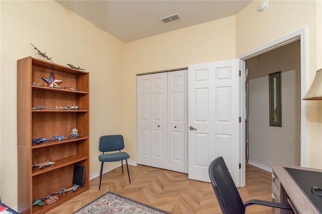 office space with light parquet flooring