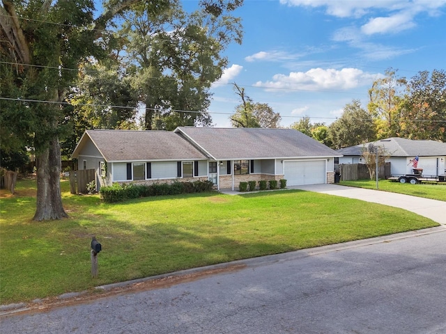 ranch-style house with a front yard and a garage