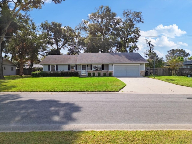 ranch-style home featuring a front yard and a garage