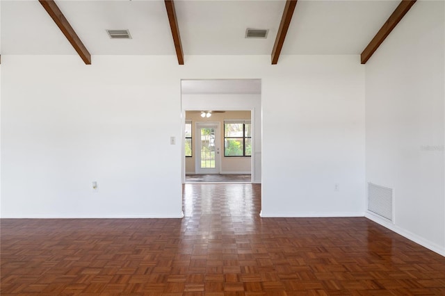 empty room featuring ceiling fan, dark parquet floors, and beamed ceiling