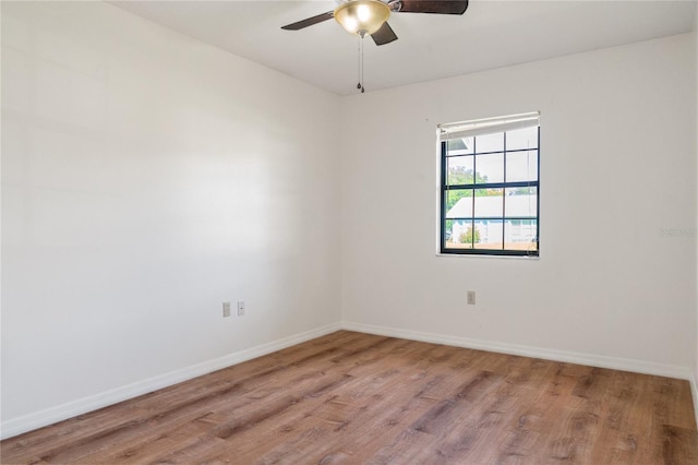 unfurnished room featuring light wood-type flooring and ceiling fan