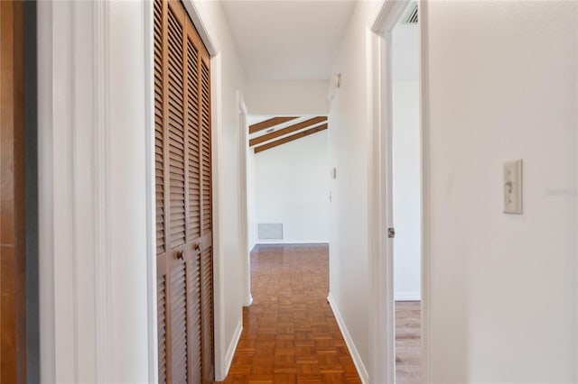 hall featuring dark parquet flooring