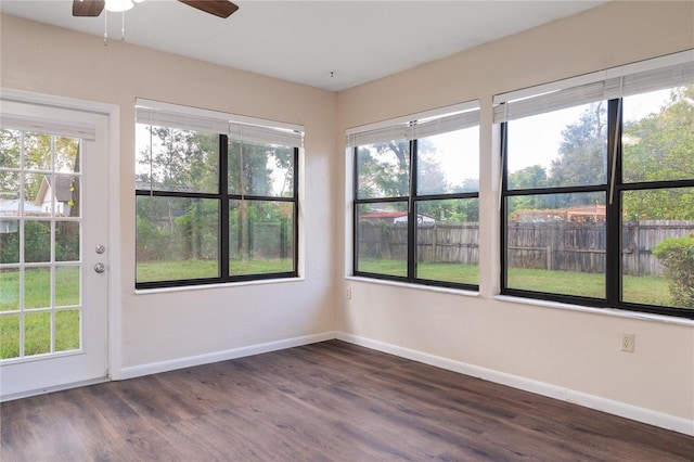 unfurnished sunroom with plenty of natural light and ceiling fan