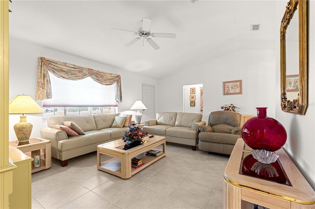 living room featuring ceiling fan, light tile patterned flooring, and lofted ceiling