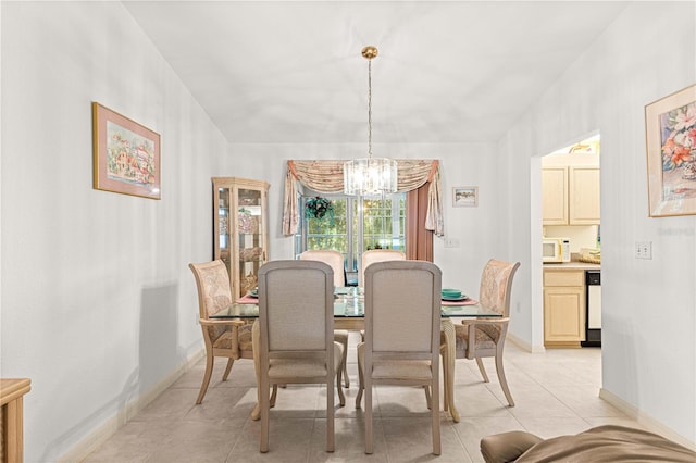 dining area with an inviting chandelier and light tile patterned flooring