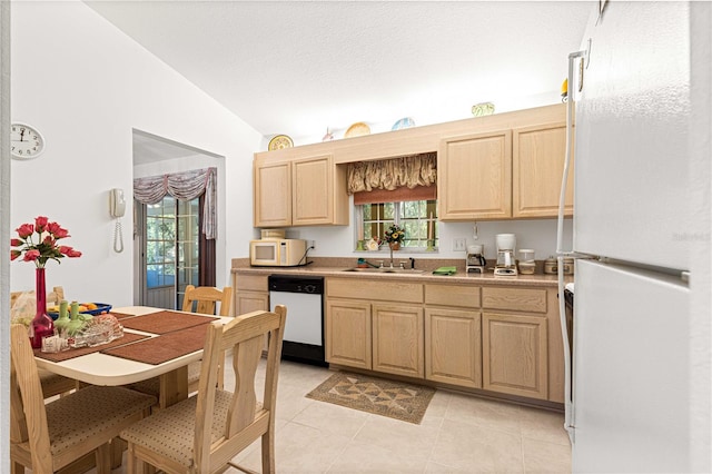 kitchen with light brown cabinetry, white appliances, a healthy amount of sunlight, and sink