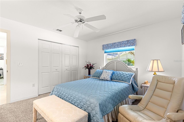 bedroom with carpet, a closet, and ceiling fan