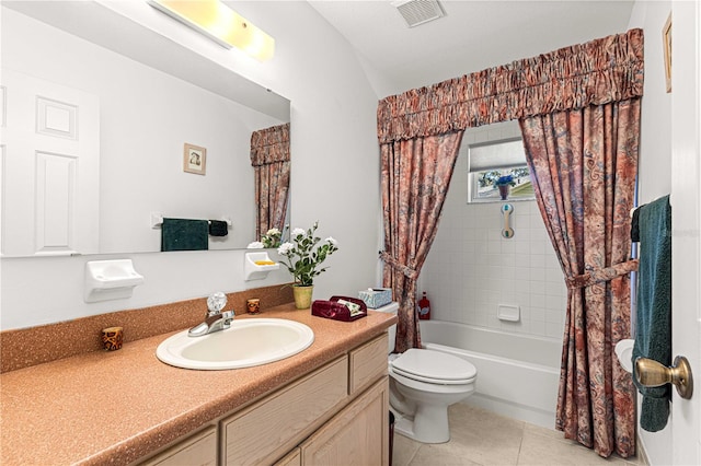 full bathroom featuring tile patterned flooring, shower / tub combo, vanity, and toilet