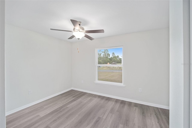 unfurnished room with ceiling fan and light hardwood / wood-style flooring