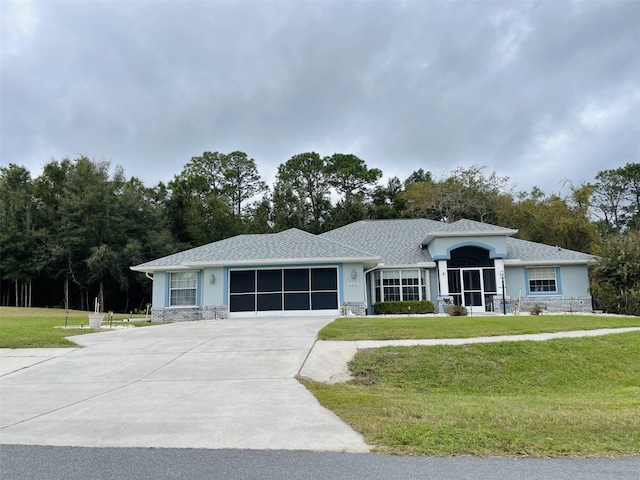 ranch-style home with a garage and a front yard