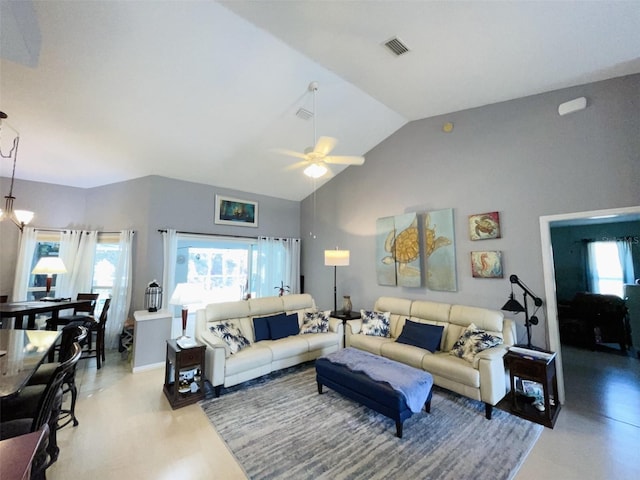 living room with ceiling fan, lofted ceiling, and a wealth of natural light