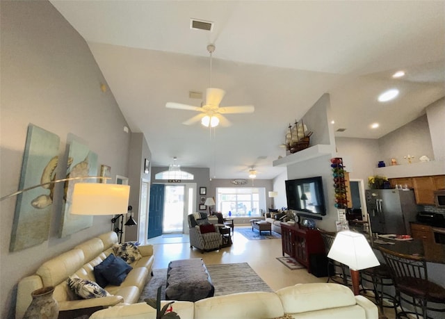 living room with ceiling fan and high vaulted ceiling