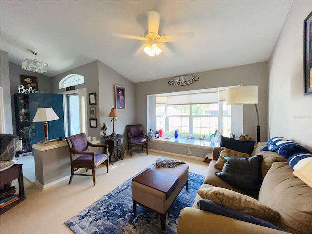 living room with carpet flooring, ceiling fan, and vaulted ceiling