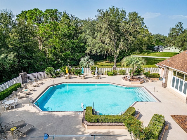 view of swimming pool featuring a patio area