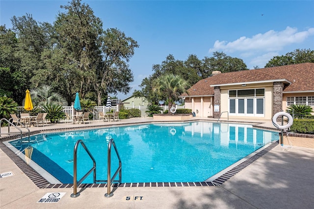 view of pool featuring a patio area