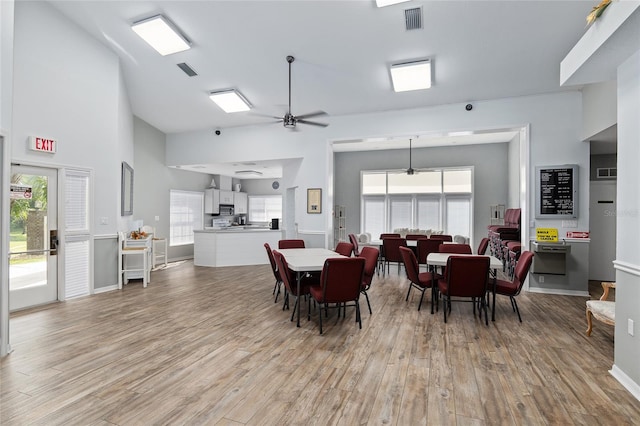 dining space featuring a wealth of natural light, ceiling fan, and light hardwood / wood-style floors