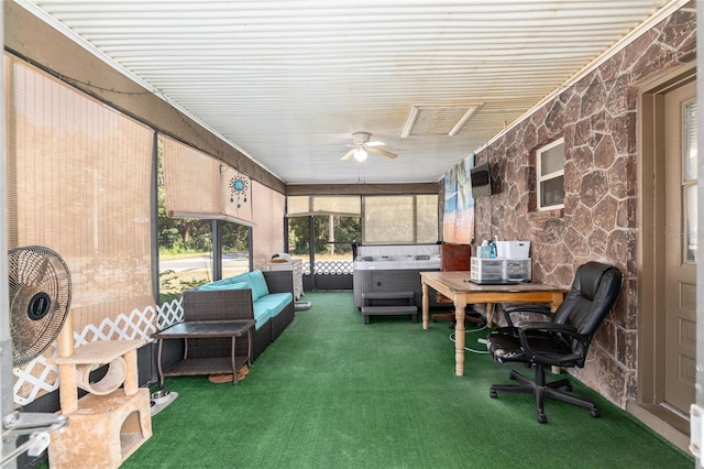 sunroom featuring ceiling fan