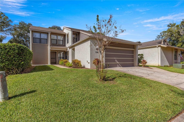 view of front of property with a garage and a front yard