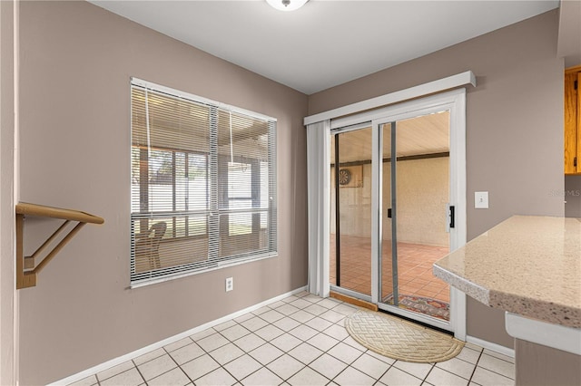 entryway with light tile patterned floors