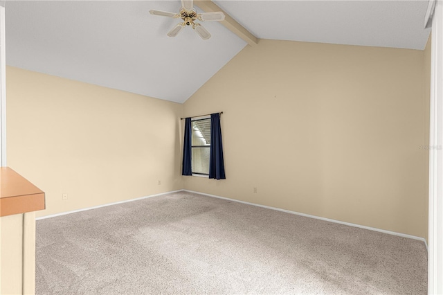 unfurnished room with vaulted ceiling with beams, ceiling fan, and carpet